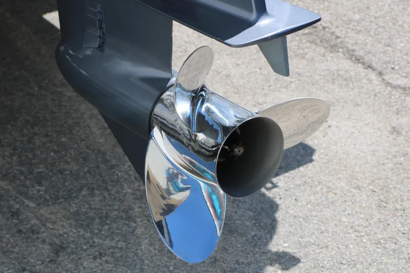 Slide: The Image of Close-up of a shiny propeller on a 2017 Berkshire 22 RFX Cts Tri-toon boat. - 10