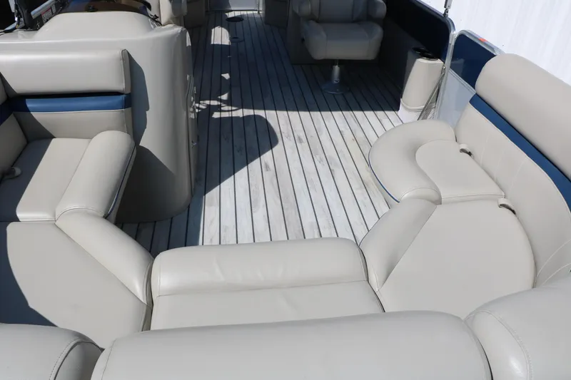 Slide: The Image of 2017 Berkshire 22 RFX Cts Tri-toon interior with beige seating and wooden flooring. - 19