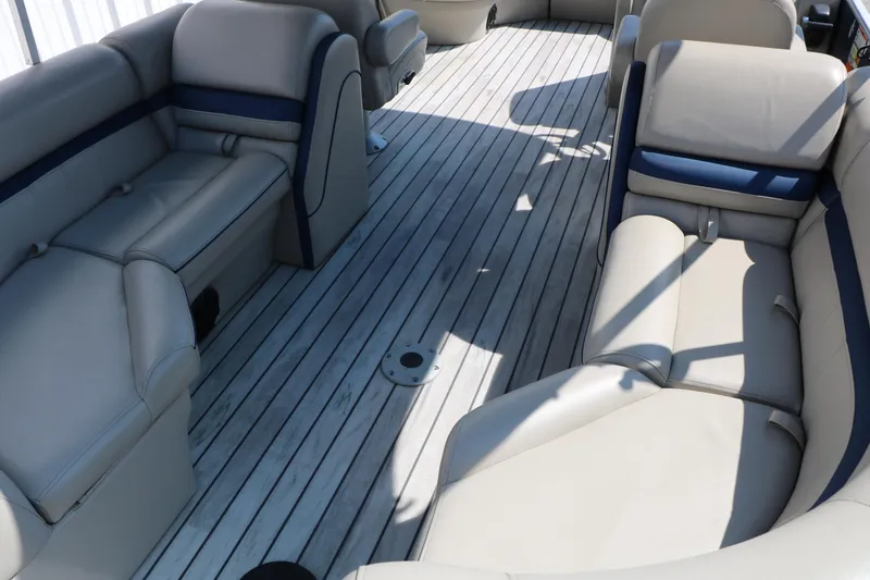 Slide: The Image of 2017 Berkshire 22 RFX Cts Tri-toon interior with spacious seating and sleek flooring. - 25