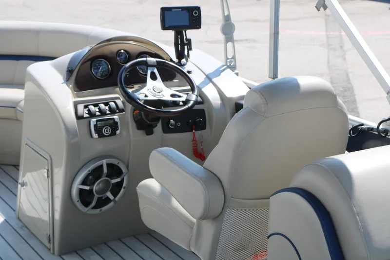 Slide: The Image of 2017 Berkshire 22 RFX Cts Tri-toon boat interior with steering wheel and controls. - 29