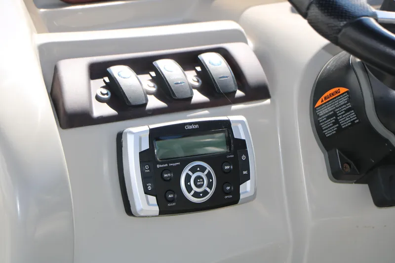 Slide: The Image of Control panel of 2017 Berkshire 22 RFX Cts Tri-toon with Clarion audio system. - 33