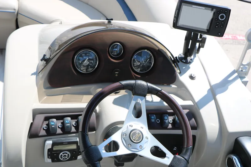 Slide: The Image of 2017 Berkshire 22 RFX Cts Tri-toon dashboard with steering wheel and navigation system. - 36