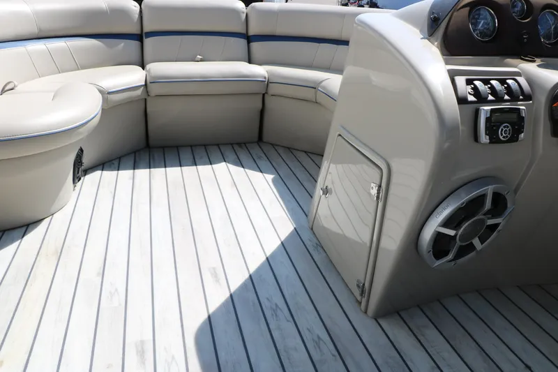 Slide: The Image of 2017 Berkshire 22 RFX Cts Tri-toon boat interior with seating and control panel. - 37