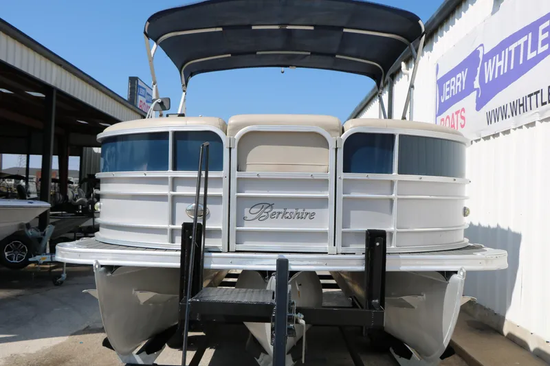 Slide: The Image of 2017 Berkshire 22 RFX Cts Tri-toon boat with canopy, docked at dealership. - 5