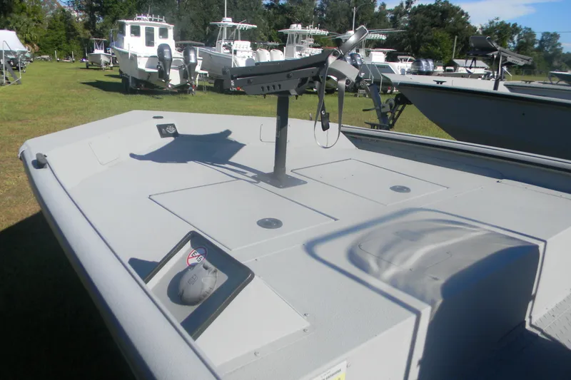 Slide: The Image of 2025 SeaArk Shadow 18 t boat deck with mounted equipment, surrounded by other boats. - 5