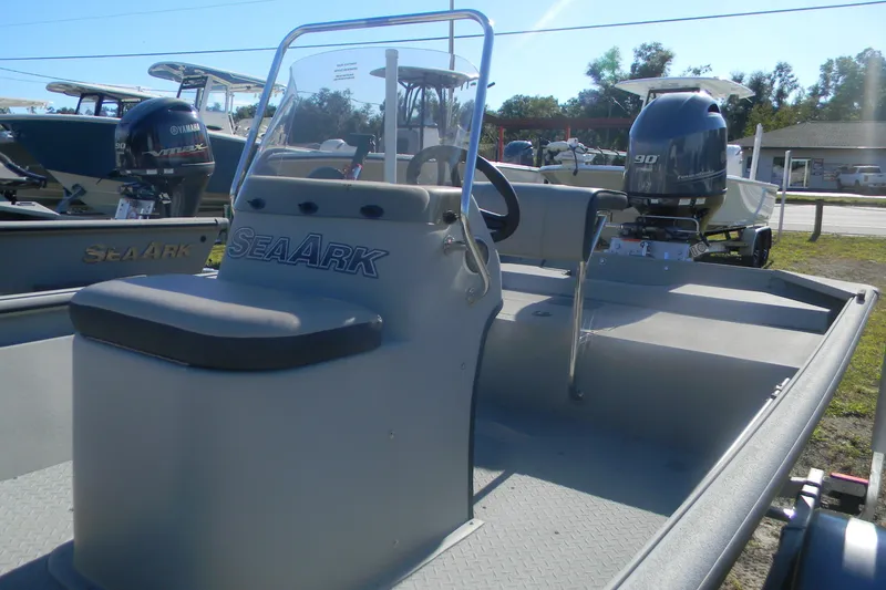 Slide: The Image of 2025 SeaArk Shadow 18 t boat with Yamaha outboard motor, displayed outdoors. - 6