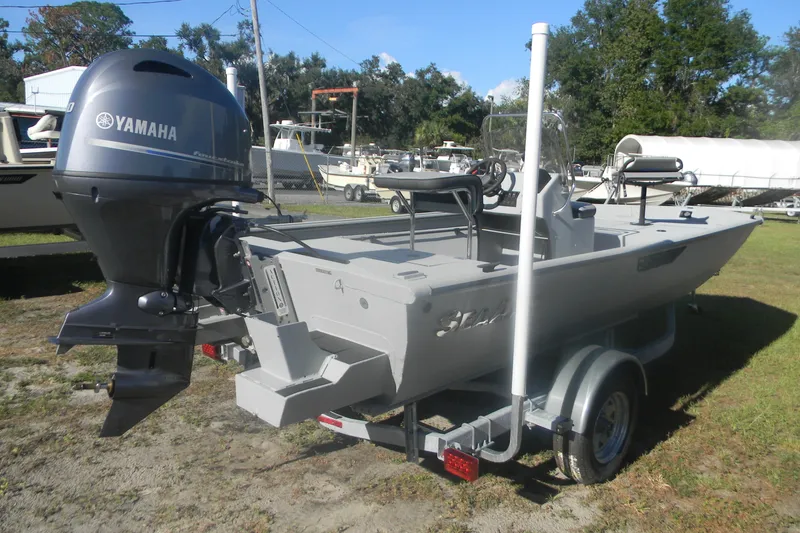 Slide: The Image of 2025 SeaArk Shadow 18 t boat with Yamaha outboard motor on trailer. - 9