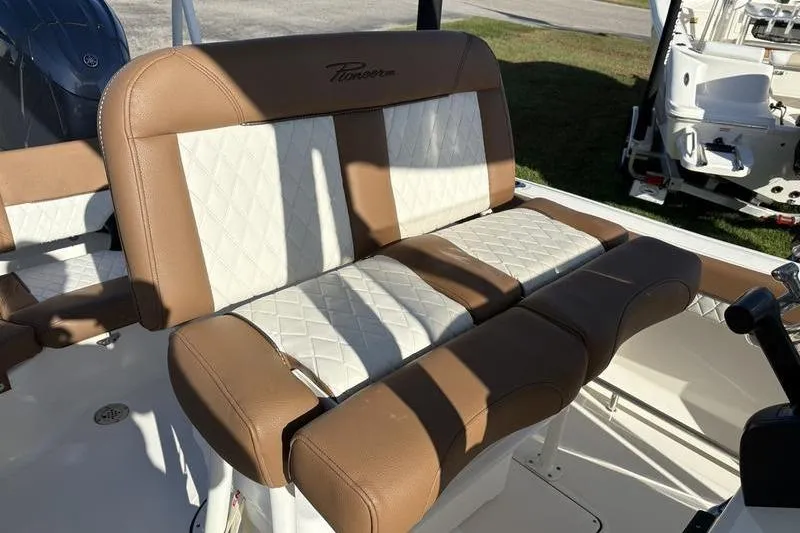 Slide: The Image of 2025 Pioneer 202 Islander boat seating with brown and white upholstery. - 14