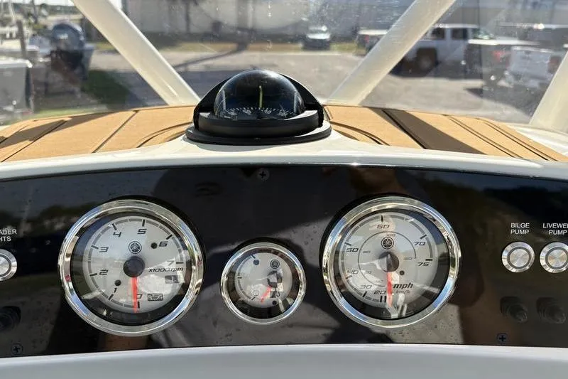 Slide: The Image of Dashboard of 2025 Pioneer 202 Islander boat with gauges and compass. - 20