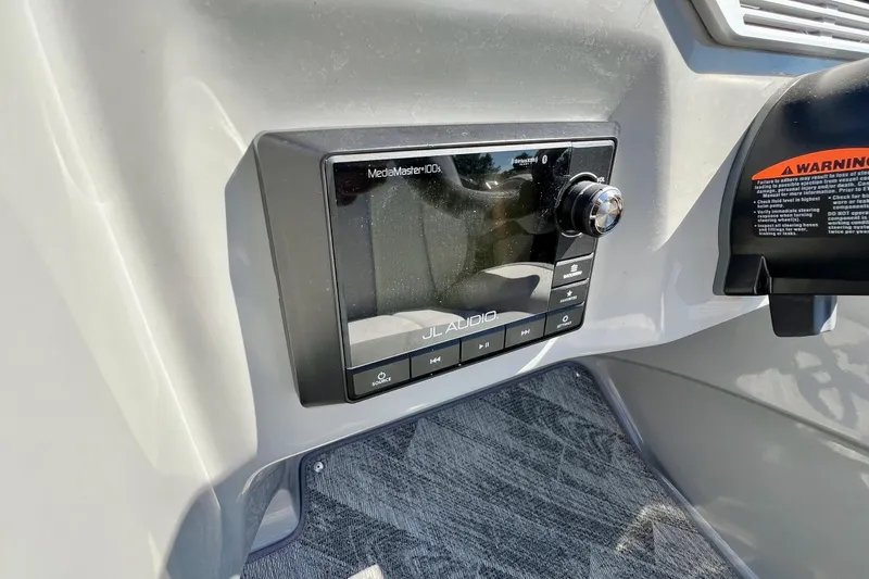 Slide: The Image of 2018 Manitou MD 25 TriToon dashboard featuring JL Audio MediaMaster 100s stereo system. - 11