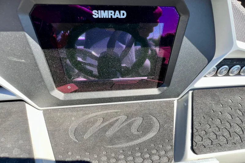 Slide: The Image of Dashboard of 2018 Manitou MD 25 TriToon with Simrad display. - 13