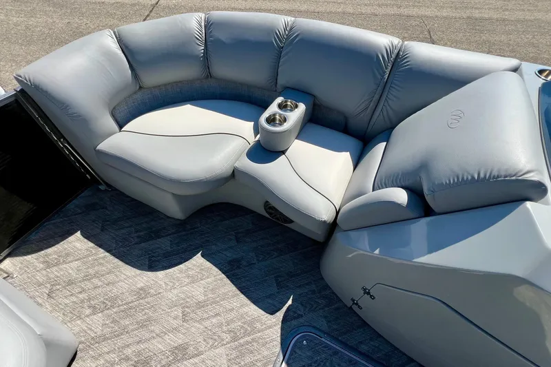 Slide: The Image of Luxurious seating on 2018 Manitou MD 25 TriToon boat with cup holders and plush upholstery. - 17