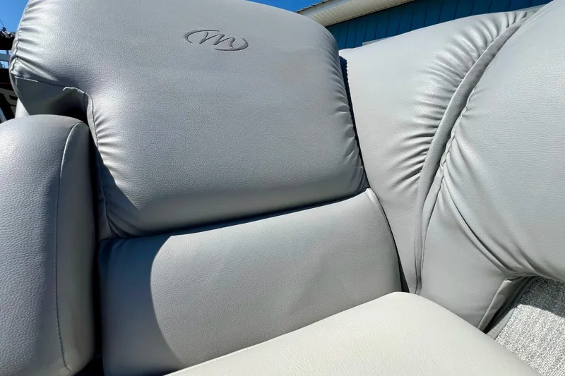 Slide: The Image of 2018 Manitou MD 25 TriToon boat seat with gray leather upholstery. - 21