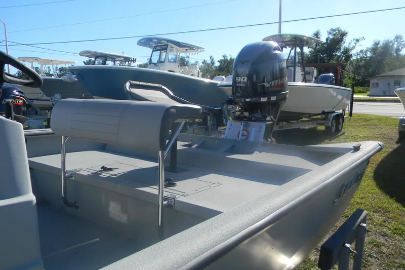 Slide: The Image of 2025 SeaArk Shadow 20 t boat with Yamaha 90 engine, parked outdoors. - 8