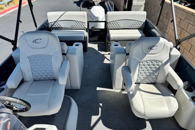 Slide: The Image of 2022 Crest Classic DLX 240 SLRC boat interior with luxurious seating and modern design. - 14