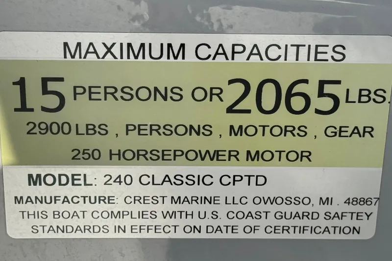 Slide: The Image of 2022 Crest Classic DLX 240 SLRC capacity label: 15 persons, 2065 lbs, 250 HP motor. - 25
