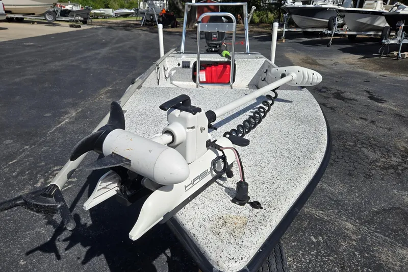 Slide: The Image of 2014 IBP 14 Skiff boat with trolling motor on a paved lot. - 10