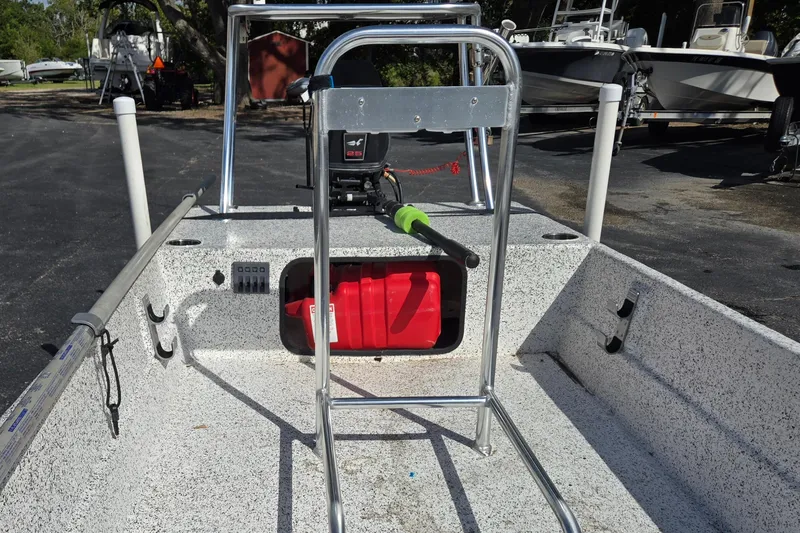 Slide: The Image of 2014 IBP 14 Skiff boat interior with steering console and fuel tank. - 11