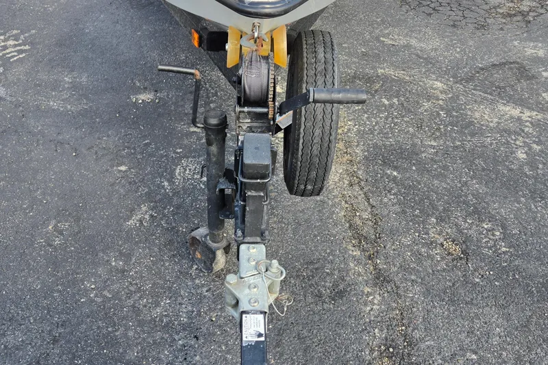 Slide: The Image of Trailer hitch and wheel assembly of 2014 IBP 14 Skiff on asphalt surface. - 9