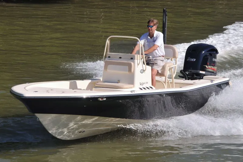 Slide: The Image of Manufacturer Provided Image: A 2026 BlackJack 224 boat cruising on water with a powerful outboard motor. - 0