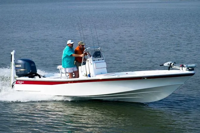Slide: The Image of Manufacturer Provided Image: 2026 BlackJack 224 boat cruising on water with two people onboard. - 1
