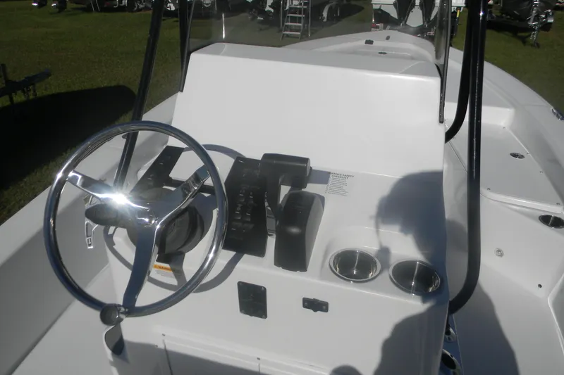 Slide: The Image of Steering console of 2026 BlackJack 224 boat with chrome wheel and controls. - 12