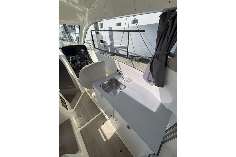 Slide: The Image of 2023 Bayliner Trophy T25 Explorer docked with Mercury 200 V6 outboard engine. - 10