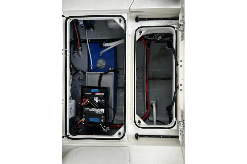 Slide: The Image of 2023 Bayliner Trophy T25 Explorer battery compartment with wiring and components. - 17