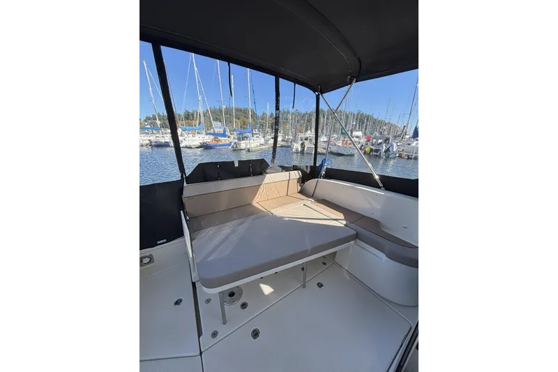 Slide: The Image of 2023 Bayliner Trophy T25 Explorer helm with modern controls and navigation system. - 4