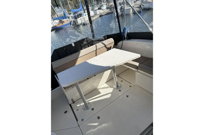 Slide: The Image of 2023 Bayliner Trophy T25 Explorer cabin interior with bed and window. - 6