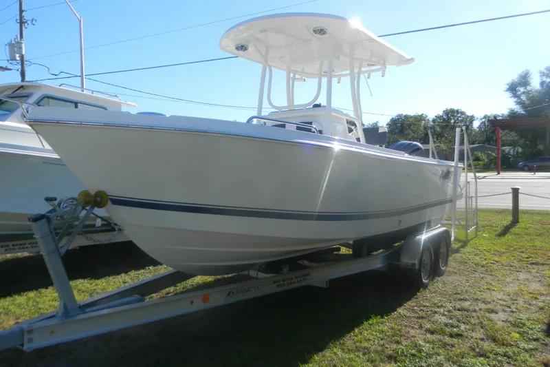 The Image of 2026 Parker 230 Coastal Elite boat on trailer, parked outdoors. - 9