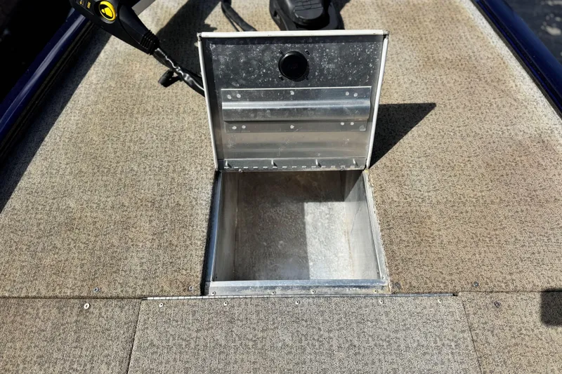 Slide: The Image of Open storage compartment on 2022 Tracker Pro 170 boat deck. - 12