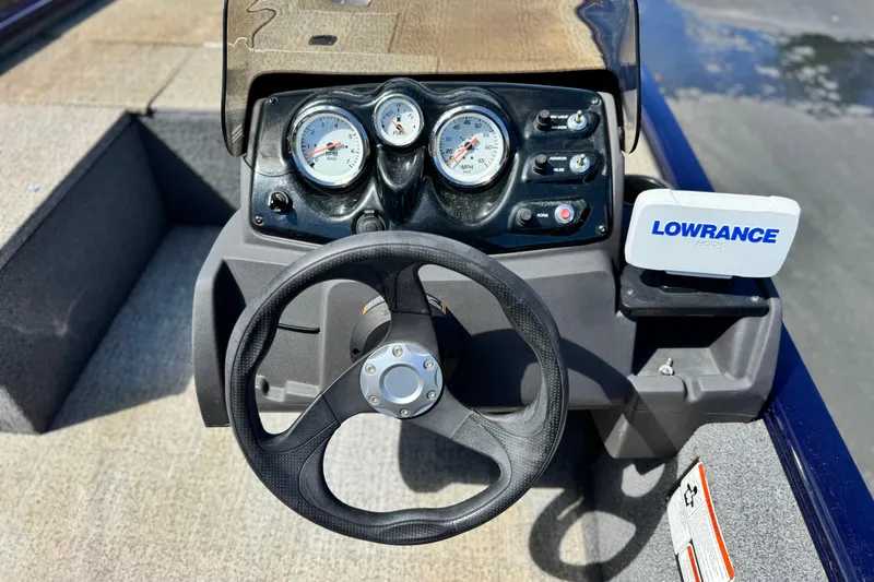 Slide: The Image of Steering console of 2022 Tracker Pro 170 boat with gauges and Lowrance device. - 19