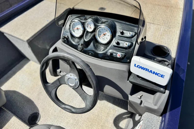 Slide: The Image of 2022 Tracker Pro 170 boat dashboard with steering wheel and Lowrance fishfinder. - 20