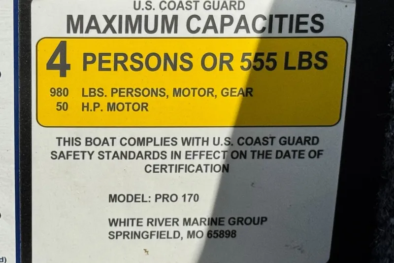 Slide: The Image of Boat capacity label for 2022 Tracker Pro 170, 4 persons or 555 lbs, 50 HP motor. - 21