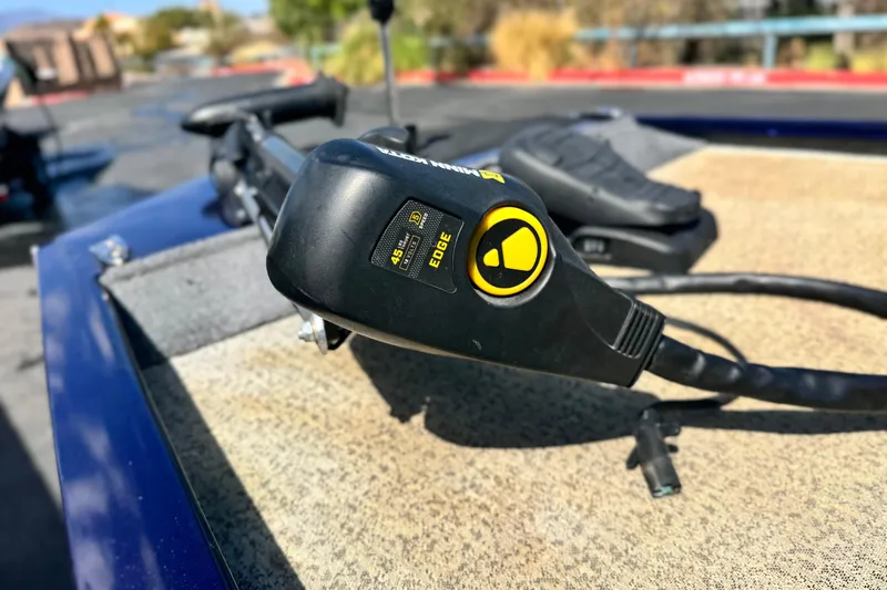 Slide: The Image of Close-up of a 2022 Tracker Pro 170 boat control panel on deck. - 8