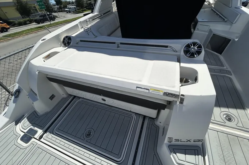 Slide: The Image of 2019 Sea Ray SLX 350 Outboard boat interior with seating and speakers. - 11
