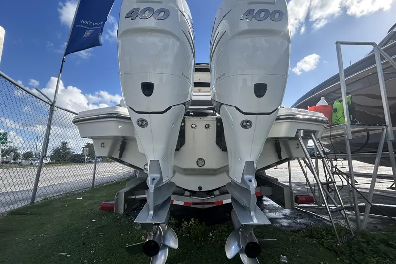 Slide: The Image of 2019 Sea Ray SLX 350 Outboard with twin 400 engines, docked outdoors. - 15