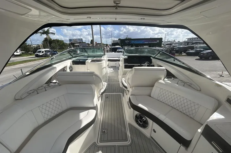 Slide: The Image of 2019 Sea Ray SLX 350 Outboard interior with luxurious seating and modern design. - 18