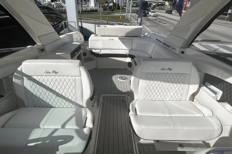Slide: The Image of 2019 Sea Ray SLX 350 Outboard interior with luxurious white seating and spacious layout. - 26
