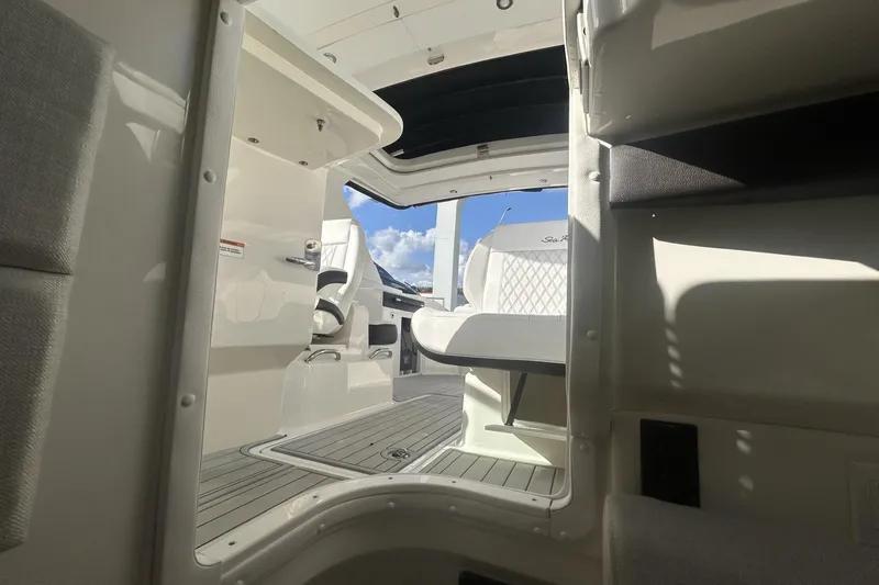 Slide: The Image of 2019 Sea Ray SLX 350 Outboard interior with seating and open deck view. - 33