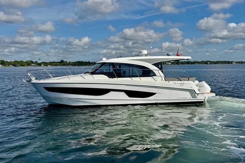 Slide: The Image of 2024 Beneteau Antares 11 yacht cruising on a sunny day with clear skies. - 16