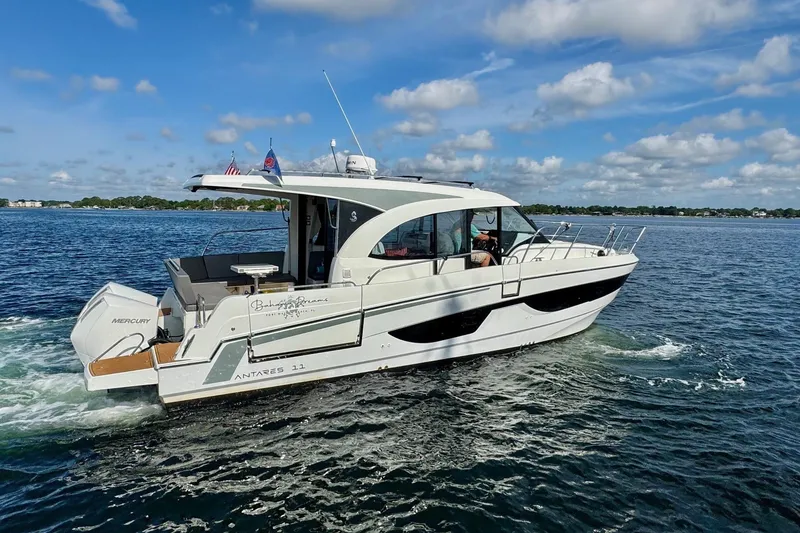 Slide: The Image of 2024 Beneteau Antares 11 cruising on a sunny day with clear skies and calm waters. - 18