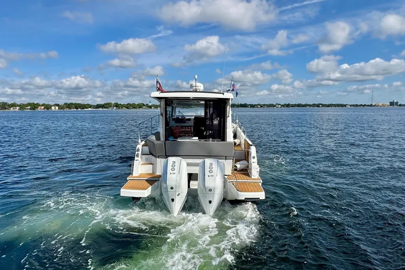 Slide: The Image of 2024 Beneteau Antares 11 yacht cruising on a sunny day with blue skies. - 5