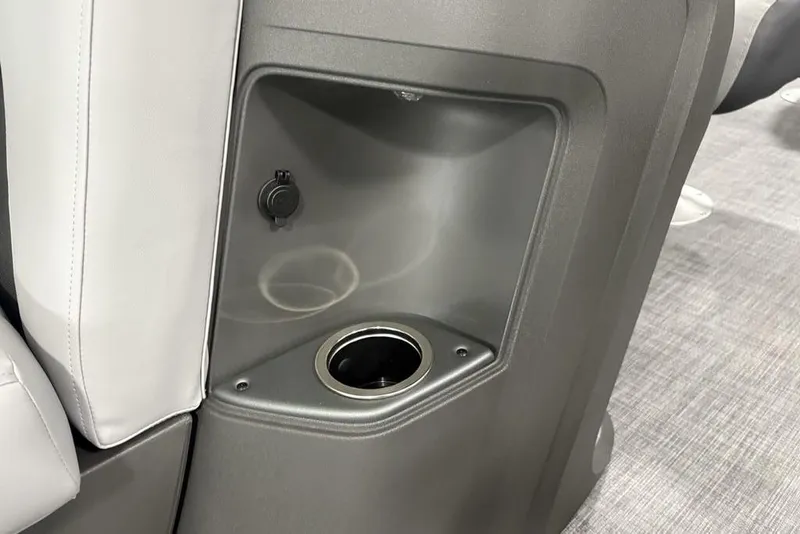 Slide: The Image of 2026 Sun Tracker SportFish 20 DLX boat interior with cup holder and storage compartment. - 15