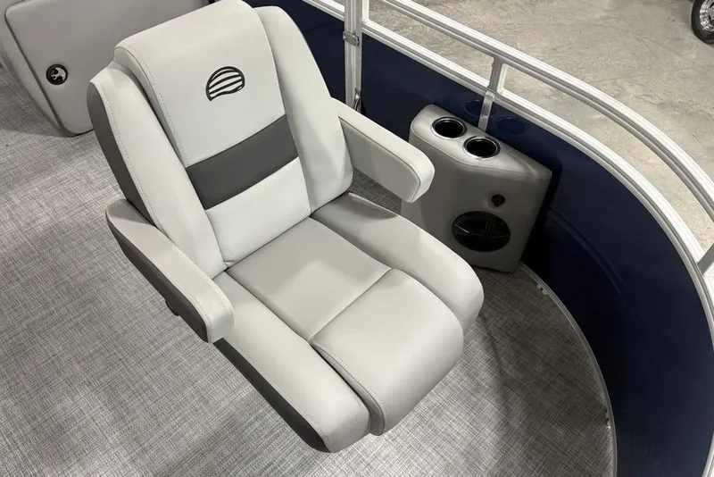 Slide: The Image of Captain's chair on 2026 Sun Tracker SportFish 20 DLX pontoon boat, featuring cup holders. - 6