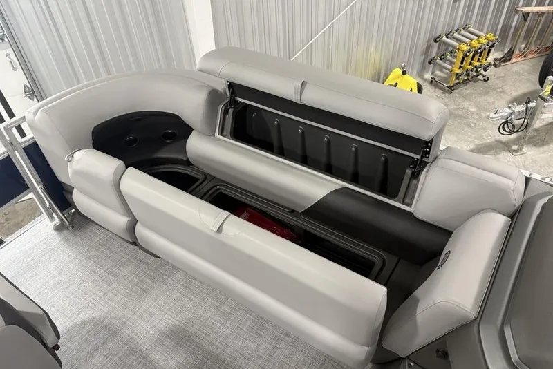 Slide: The Image of 2026 Sun Tracker SportFish 20 DLX boat interior with gray seating and storage compartments. - 8