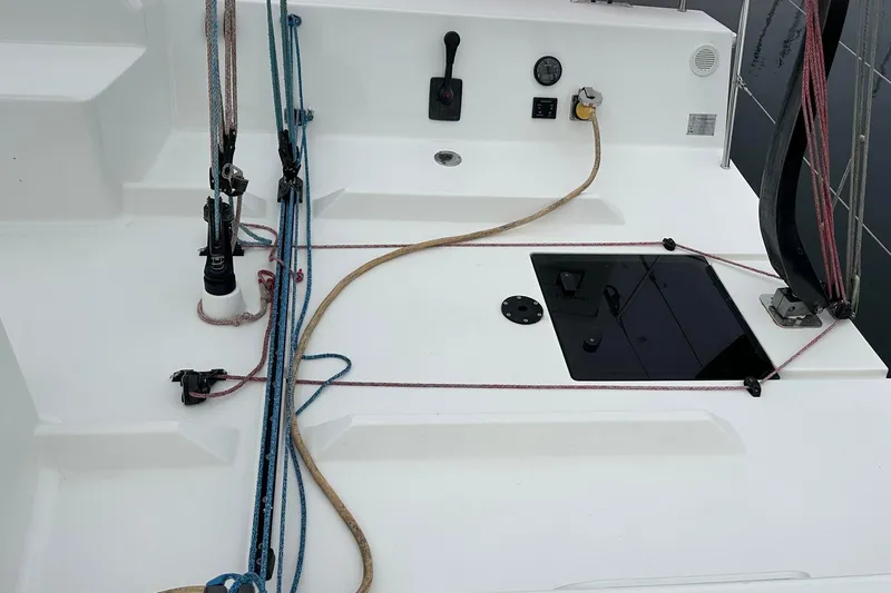 Slide: The Image of 2021 J Boats J99 sailboat deck with ropes and control panel. - 11