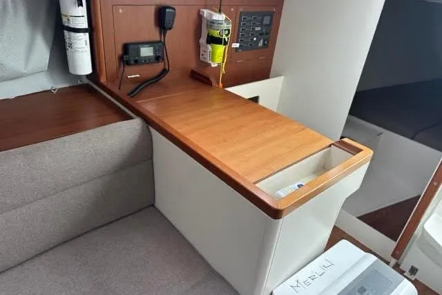 Slide: The Image of 2021 J Boats J99 interior with navigation equipment and wooden finish. - 17