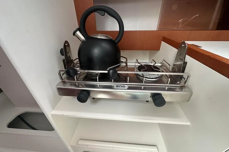 Slide: The Image of Compact stove with kettle in 2021 J Boats J99 yacht interior. - 20